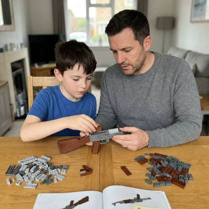 Father and son building the AK-47 brick kit together at the table