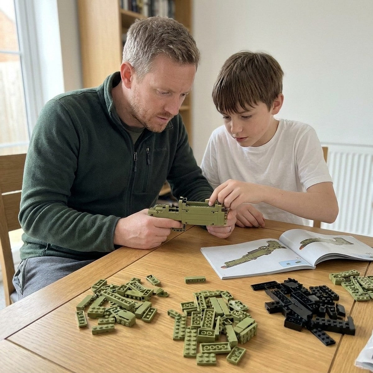 Father and son building the Super Magnum brick kit together at the dining table