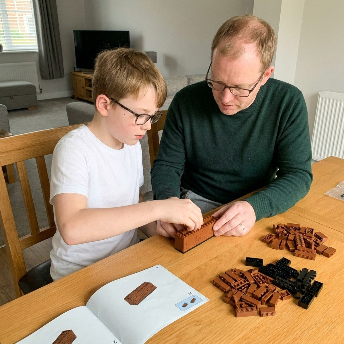 Father and son building the Thunder double-barrel brick kit together
