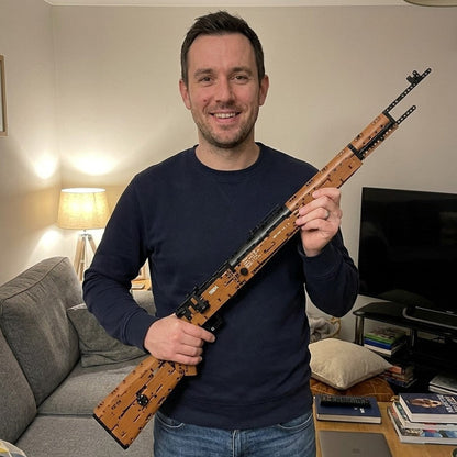 Finished Karabiner 98K brick model held in a living room, full 104 cm length