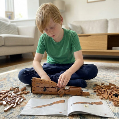 Boy building the Karabiner 98K brick kit on the living-room rug