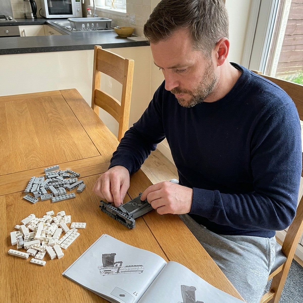 Building the Magnum Eagle brick pistol at the kitchen table: grip first, loose bricks and the manual