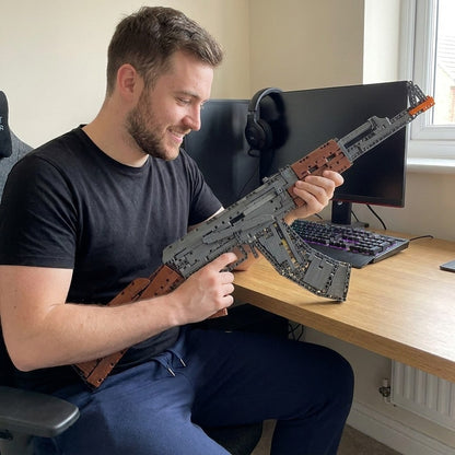 Fitting the curved magazine to the finished AK-47 brick model at a desk
